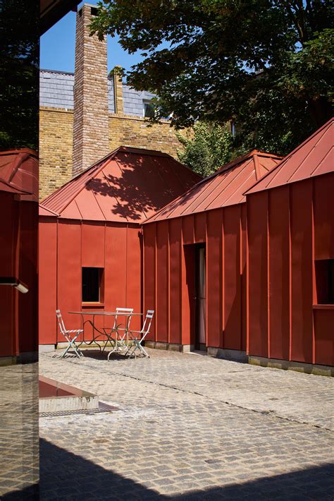 red metal tin houses|Henning Stummel's London home formed of pyramidal rooms.